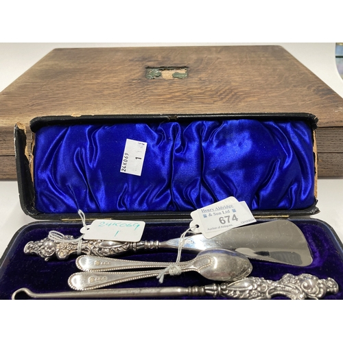 674 - Hallmarked Silver: Hallmarked Silver: Early 20th cent. silver-handled shoehorn & button hook set... 