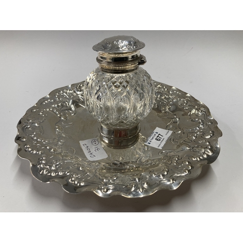 677 - Hallmarked Silver: Hallmarked Silver: A hobnail cut glass inkwell with ornate silver hinged lid, par... 