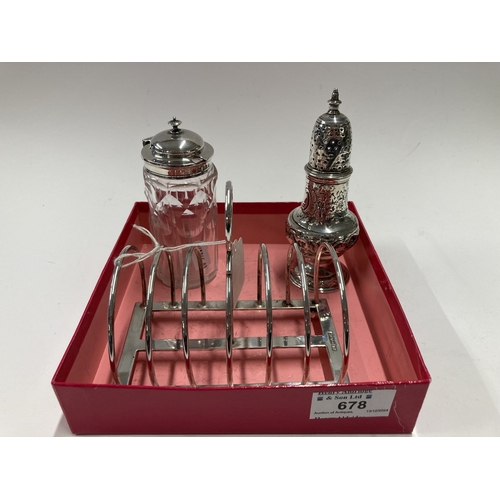 678 - Silver: Silver: A six section silver toast rack, Sheffield 1924, a George III silver caster, London ... 