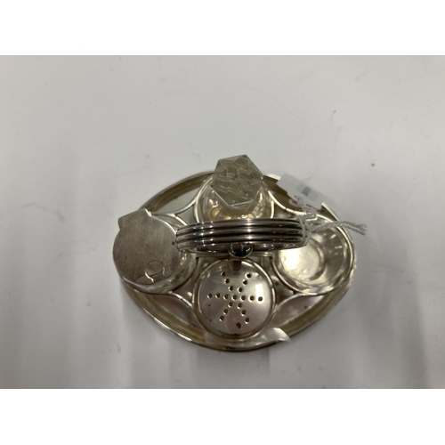 686 - Hallmarked Silver: Hallmarked Silver: A Scottish silver cruet stand with reeded handle, Edinburgh 19... 