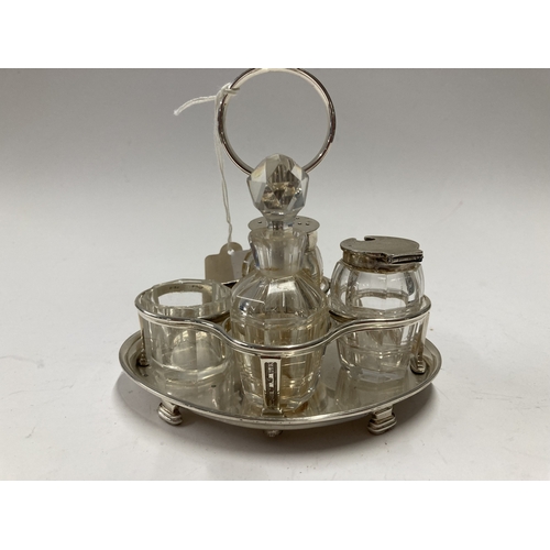 686 - Hallmarked Silver: Hallmarked Silver: A Scottish silver cruet stand with reeded handle, Edinburgh 19... 