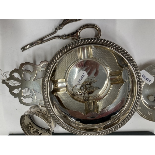 687 - Silver: Silver: A small Armada dish, an ashtray, a single napkin ring, an American porringer by Fish... 