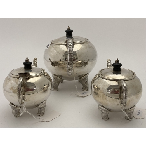 689a - Silver: Silver: An Indian three piece tea set by Cooke & Kelvey, each piece bearing their hallma... 