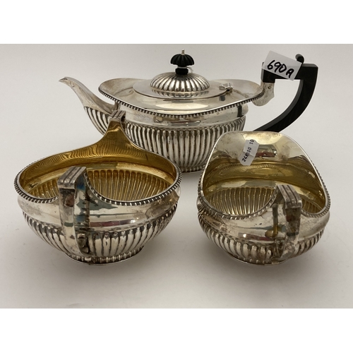 690a - Hallmarked Silver: Hallmarked Silver: A harlequin three piece tea set, London 1895 and Sheffield 189... 