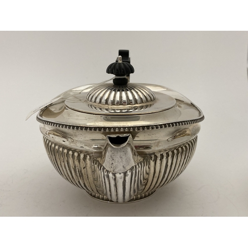 690a - Hallmarked Silver: Hallmarked Silver: A harlequin three piece tea set, London 1895 and Sheffield 189... 