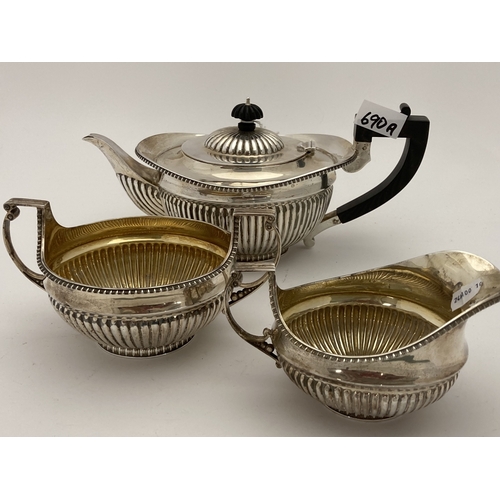 690a - Hallmarked Silver: Hallmarked Silver: A harlequin three piece tea set, London 1895 and Sheffield 189... 