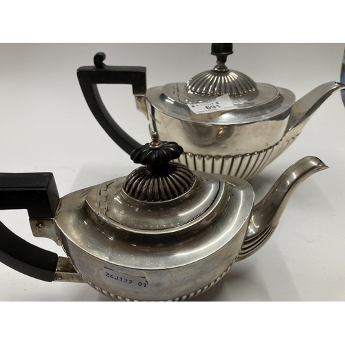 691 - Hallmarked Silver: Hallmarked Silver: A gadrooned silver teapot by Roberts & Belk, Sheffield 191... 