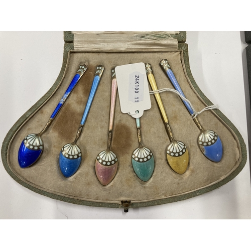 710 - Hallmarked Silver: Hallmarked Silver: A set of enamelled silver gilt coffee spoons, import marks for... 