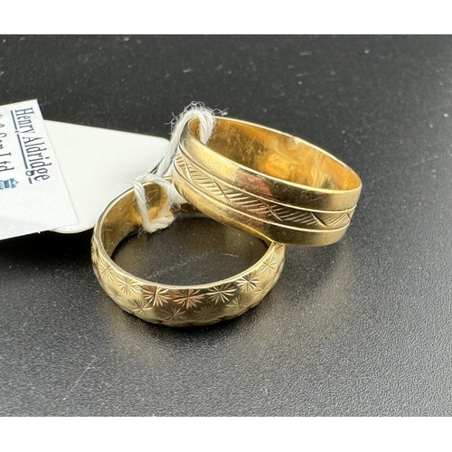 725 - Jewellery: Jewellery: Two engraved 9ct gold wedding bands, one 6.8mm wide, UK size T, the other 5.7m... 