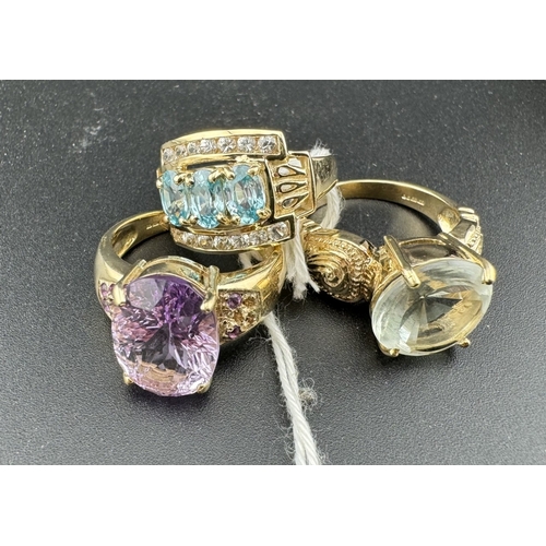 730 - Jewellery: Jewellery: A 9ct gold ring with central amethyst, further stones to the shoulders (losses... 