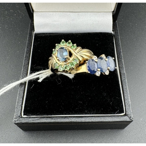 734 - Jewellery: Jewellery: A 9ct gold ring set with three oval sapphires, divided by four white stones, s... 