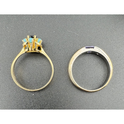 751 - Jewellery: Jewellery: A white metal ring, unmarked but testing as 9ct gold, set a central princess c... 