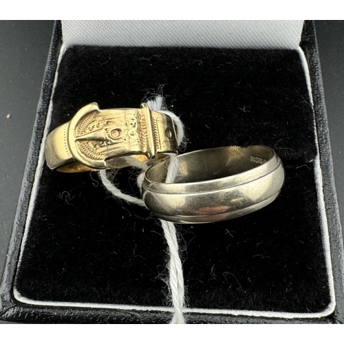 756 - Jewellery: Jewellery: A 9ct yellow gold buckle ring, UK size I, together with a 9ct white gold weddi... 