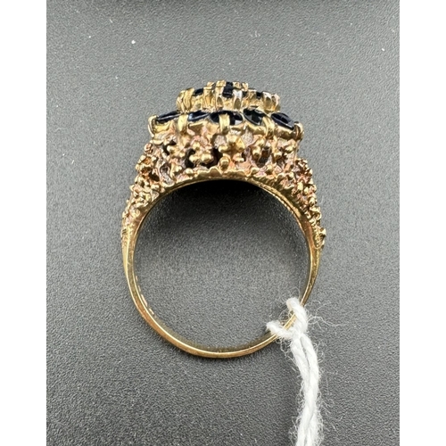 758 - Jewellery: Jewellery: A 9ct gold and sapphire cluster ring with a pierced bark effect mount, UK size... 