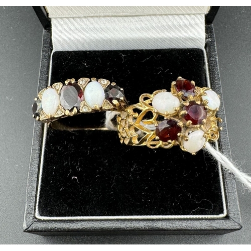 762 - Jewellery: Jewellery: A 9ct yellow gold ring set three graduated garnets divided by opals, further s... 