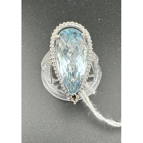 769 - Jewellery: Jewellery: An 18ct white gold ring, set a facet cut pear shaped aquamarine measuring appr... 