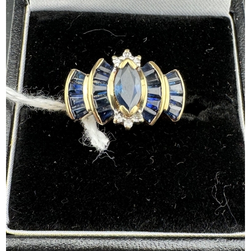 771 - Jewellery: Jewellery: A 9ct gold Art Deco style ring, a central marquise cut sapphire with three dia... 