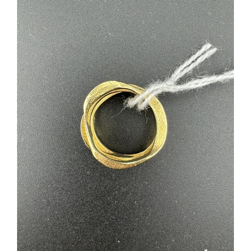 774 - Jewellery: Jewellery: A yellow metal ring, indistinctly marked but testing as 18ct gold, designed as... 