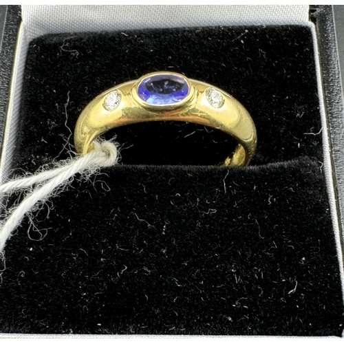 778 - Jewellery: Jewellery: A yellow metal ring, marked 'KEMAS 750' and testing as 18ct gold, set a centra... 