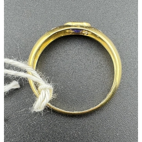 778 - Jewellery: Jewellery: A yellow metal ring, marked 'KEMAS 750' and testing as 18ct gold, set a centra... 