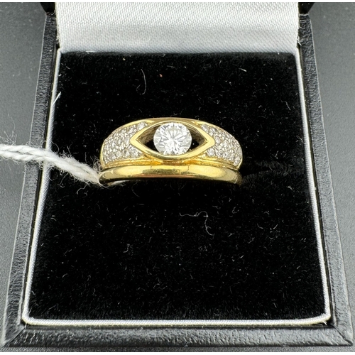 782 - Jewellery: Jewellery: A yellow metal ring, marked 750 and testing as 18ct gold, set with a central 3... 