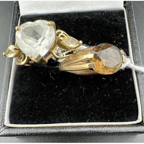 783 - Jewellery: Jewellery: A 9ct yellow gold ring set with a central heart shaped white stone flanked by ... 