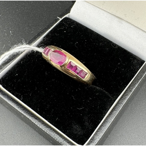 786 - Jewellery: Jewellery: A yellow metal ring, marked 585 and tests as 14ct gold, set a central oval rub... 