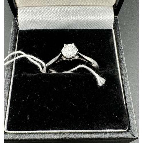 796 - Jewellery: Jewellery: Platinum and diamond solitaire ring, the stone set in a raised mount with pier... 