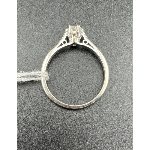 796 - Jewellery: Jewellery: Platinum and diamond solitaire ring, the stone set in a raised mount with pier... 