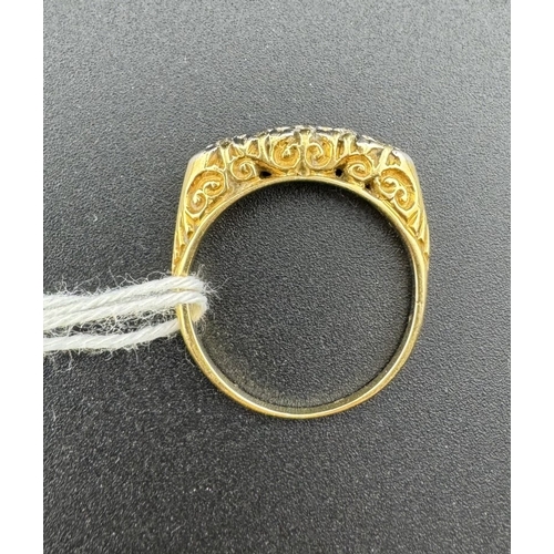 799 - Jewellery: Jewellery: An early 20th century yellow metal ring, testing as 18ct gold, set with five g... 