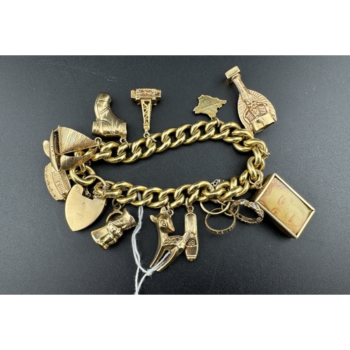 812 - Jewellery: Jewellery: A 9ct gold curb link charm bracelet, with heart shaped clasp. Suspended with 1... 