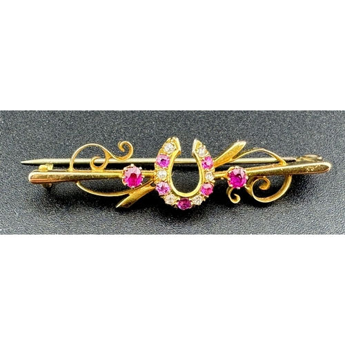 821 - Jewellery: Jewellery: A 15ct gold bar brooch, a central horseshoe set with alternate diamonds and ru... 