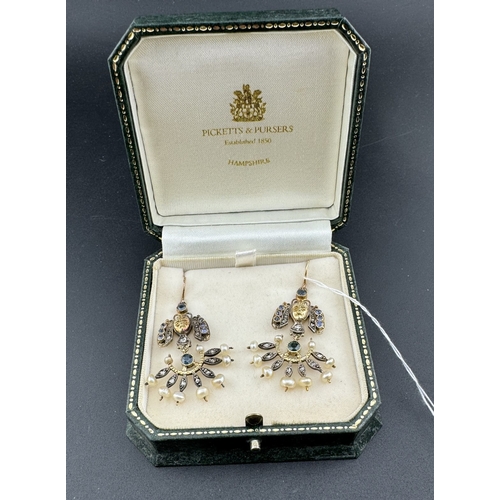 828 - Jewellery: Jewellery; A boxed pair of Egyptian revival yellow metal drop earrings, set with diamonds... 