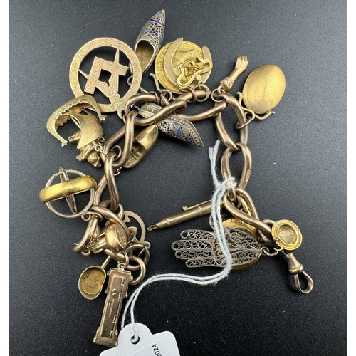 829 - Jewellery: Jewellery: A 9ct gold charm bracelet, suspended with around 20 charms, to include: a 1914... 