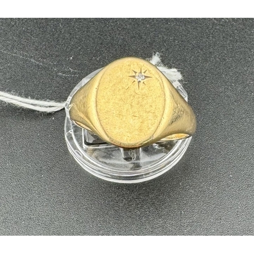 834 - Jewellery: Jewellery: A man's 9ct gold signet ring, the table set a small diamond. UK size U, 6.4g.... 