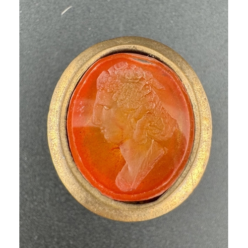 848 - Jewellery: Jewellery: Three 19th century yellow metal fob seals, one set a carnelian carved with the... 