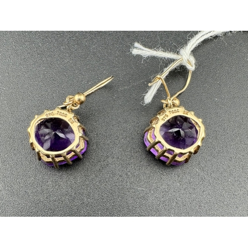 851 - Jewellery: Jewellery: Boxed 9ct gold mounted facet cut amethyst earrings, each cushion cut stone app... 