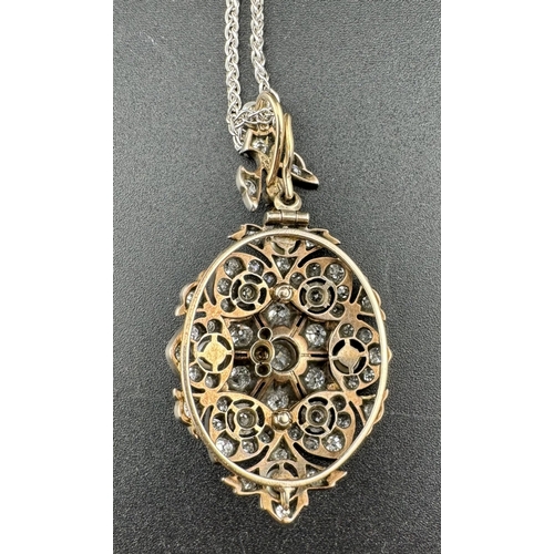 856 - Jewellery: Jewellery: A late 19th century lavalier necklace, the oval yellow and white metal pendant... 