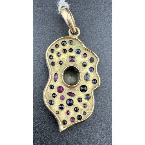 866 - Jewellery: Jewellery: A yellow metal leaf shaped pendant, probably Indian, set with rubies, sapphire... 