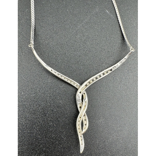 871 - Jewellery: Jewellery: A white metal pendant necklace, marked 375 and testing as 9ct gold, set with s... 