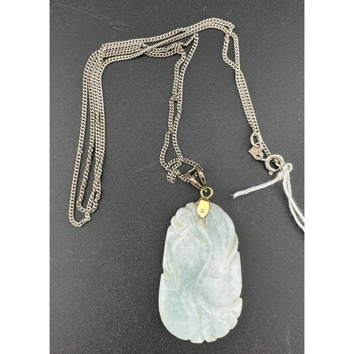 883 - Jewellery: Jewellery: Jadeite pendant with 14Kt marked mount and Continental white metal chain.... 