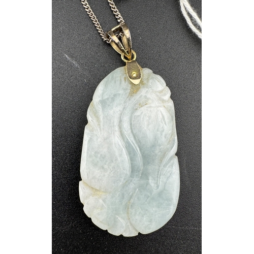 883 - Jewellery: Jewellery: Jadeite pendant with 14Kt marked mount and Continental white metal chain.... 