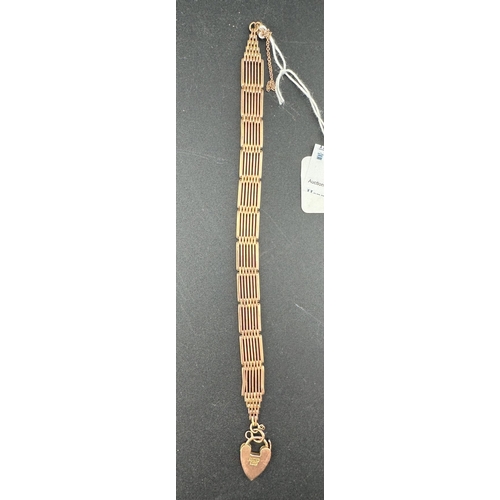 885 - Jewellery: Jewellery: A 9ct rose gold 7 bar gate bracelet, with heart clasp. 18cm, 16.7g.... 