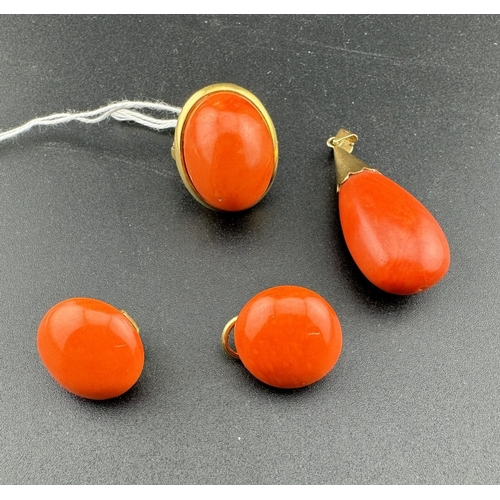 896 - Jewellery: Jewellery: An 18ct yellow gold ring, set a single red coral cabochon measuring 23mm by 17... 