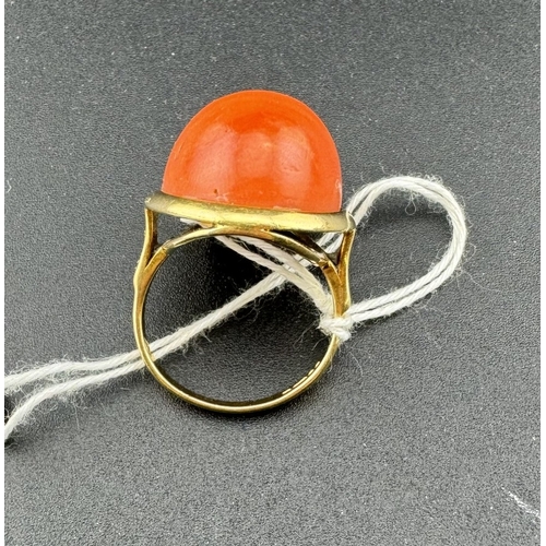 896 - Jewellery: Jewellery: An 18ct yellow gold ring, set a single red coral cabochon measuring 23mm by 17... 