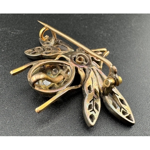 897 - Jewellery: Jewellery: A late 19th century yellow metal brooch in the form of a bee, the wings and ab... 