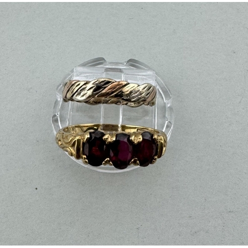 904 - Jewellery: Jewellery: A 9ct yellow gold ring set with three garnets, UK size O, together with a 9ct ... 