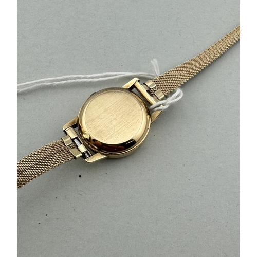 931 - Watches: Watches: A ladies gold plated Omega Deville quartz wristwatch with integral mesh strap, the... 