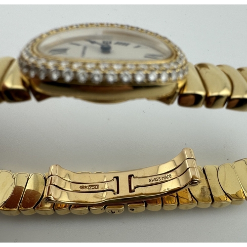 947 - Watches: Watches: A Cartier Baignoire ladies wristwatch in 18ct gold, the oval dial set a double hal... 