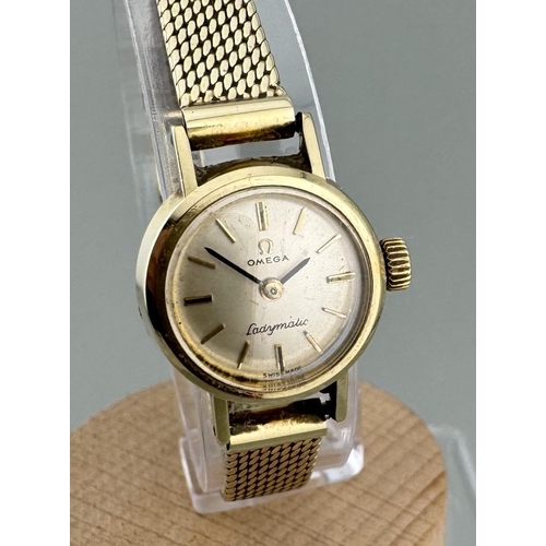 958 - Watches: Watches: A ladies 14ct gold Omega Ladymatic watch, Cal 661 movement, with 14ct gold mesh st... 